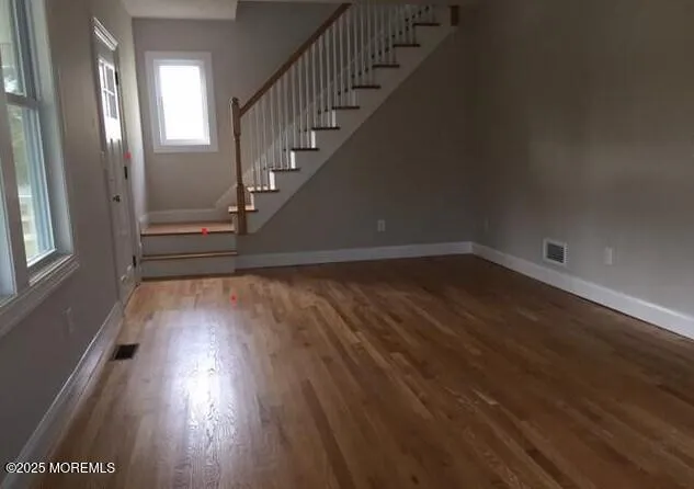 a view of entryway with wooden floor