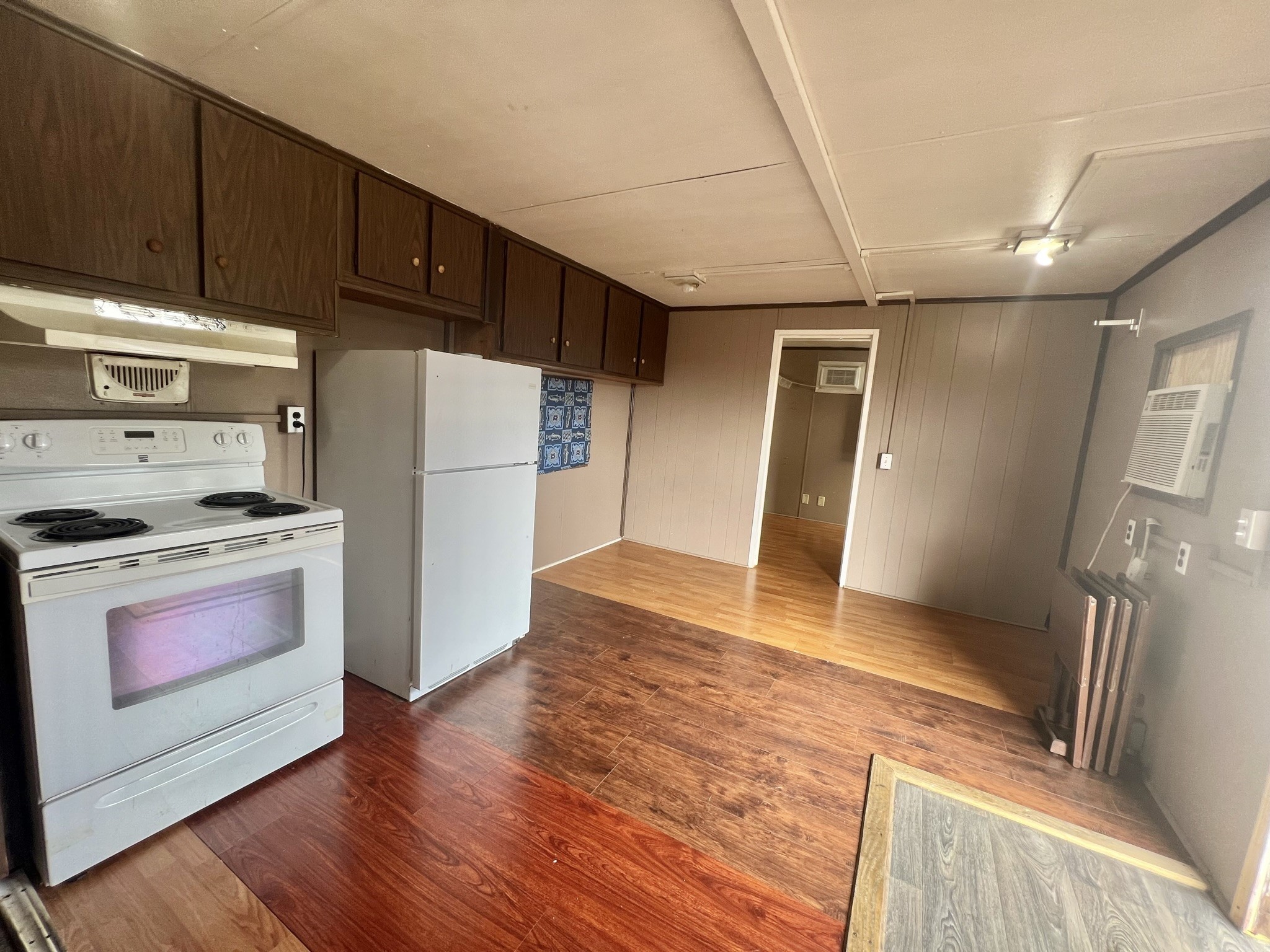 2749 Wagon Trail Road Pearland, TX 77584 - Photo 8 of 18 a kitchen with granite countertop a refrigerator and a stove