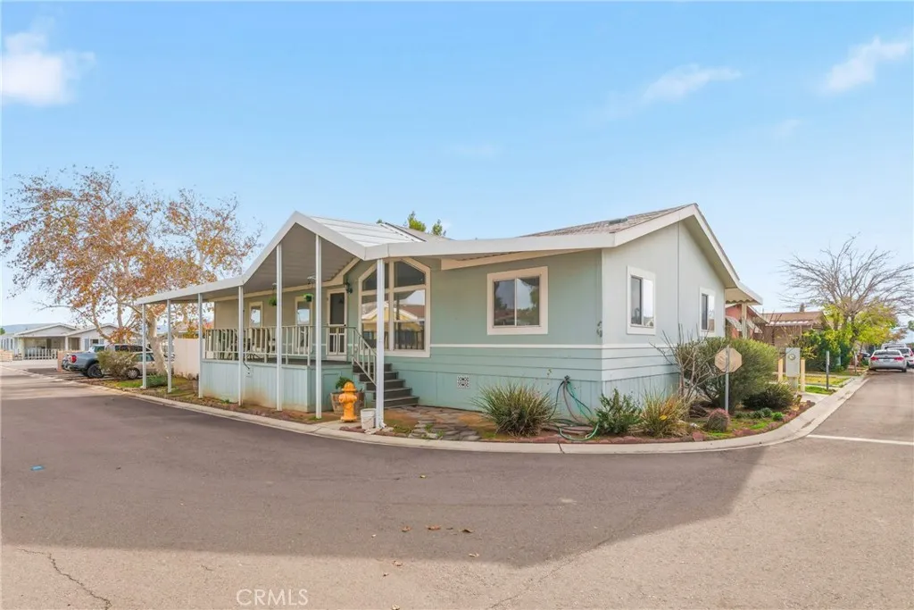 20843 Waalew Road, Unit C48 Apple Valley, CA 92307 - Photo 1 of 33 a view of a street with a house