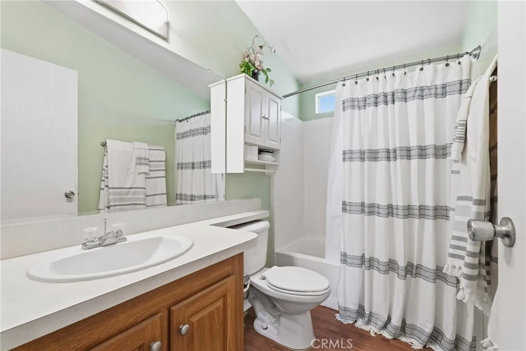 20843 Waalew Road, Unit C48 Apple Valley, CA 92307 - Photo 24 of 33 a bathroom with a sink a toilet and shower