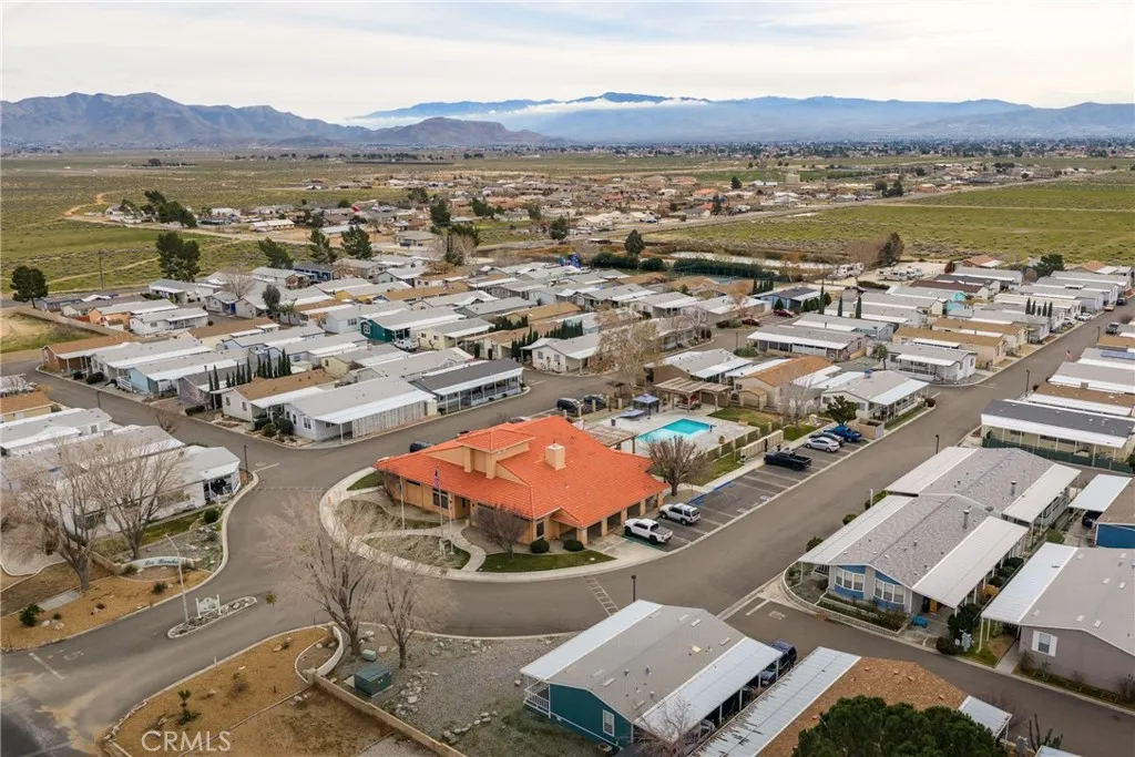 20843 Waalew Road, Unit C48 Apple Valley, CA 92307 - Photo 32 of 33 an aerial view of residential houses with outdoor space