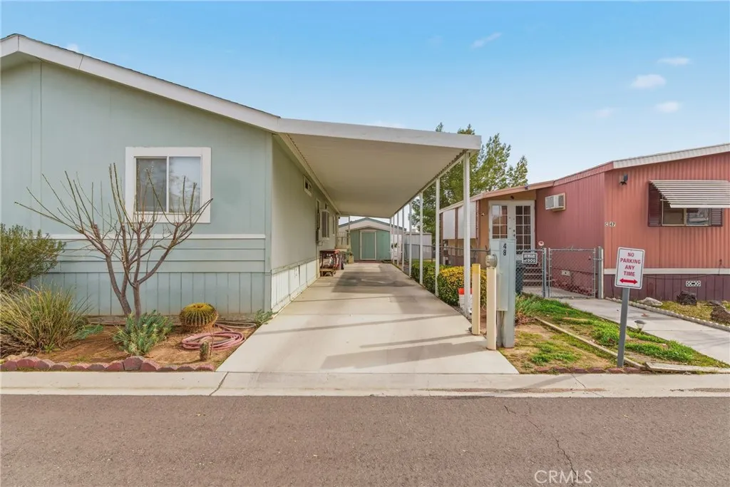 20843 Waalew Road, Unit C48 Apple Valley, CA 92307 - Photo 6 of 33 a view of a house with a street