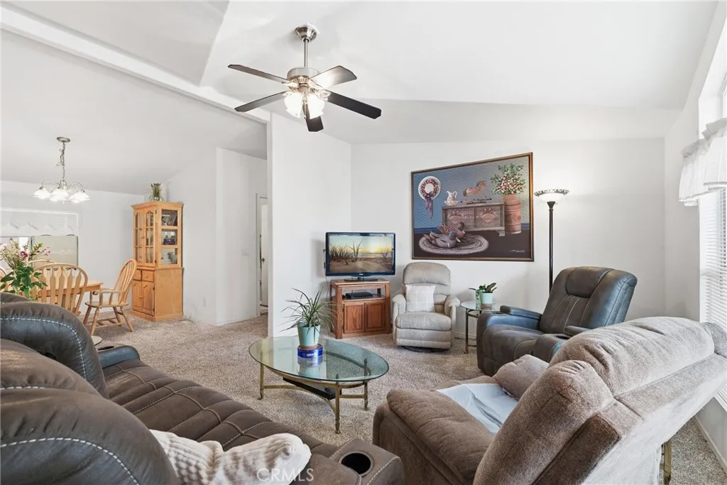 20843 Waalew Road, Unit C48 Apple Valley, CA 92307 - Photo 7 of 33 a living room with furniture and a large window