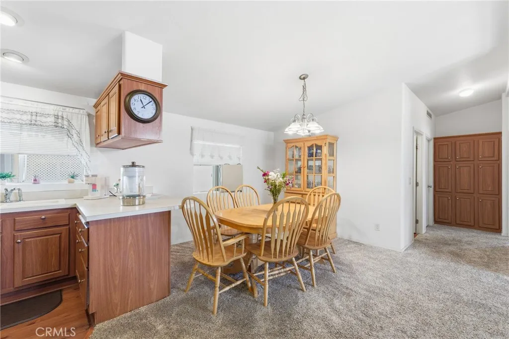 20843 Waalew Road, Unit C48 Apple Valley, CA 92307 - Photo 9 of 33 a dining room with furniture and window