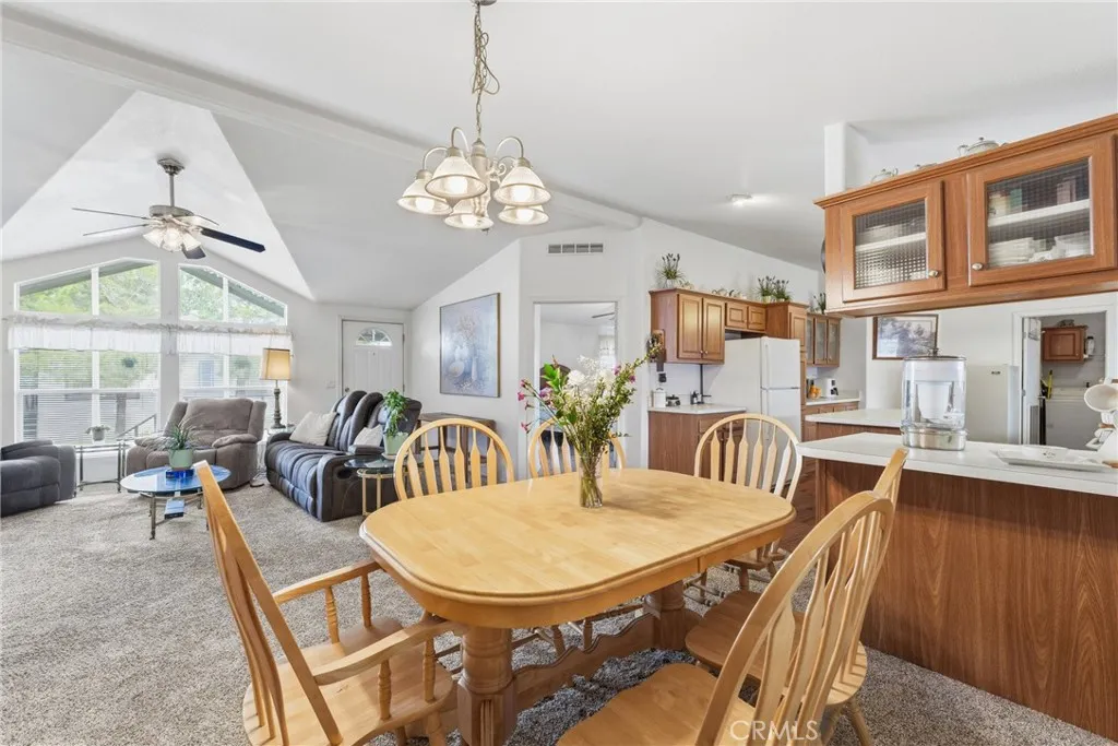 20843 Waalew Road, Unit C48 Apple Valley, CA 92307 - Photo 10 of 33 a view of a dining room with furniture window and outside view
