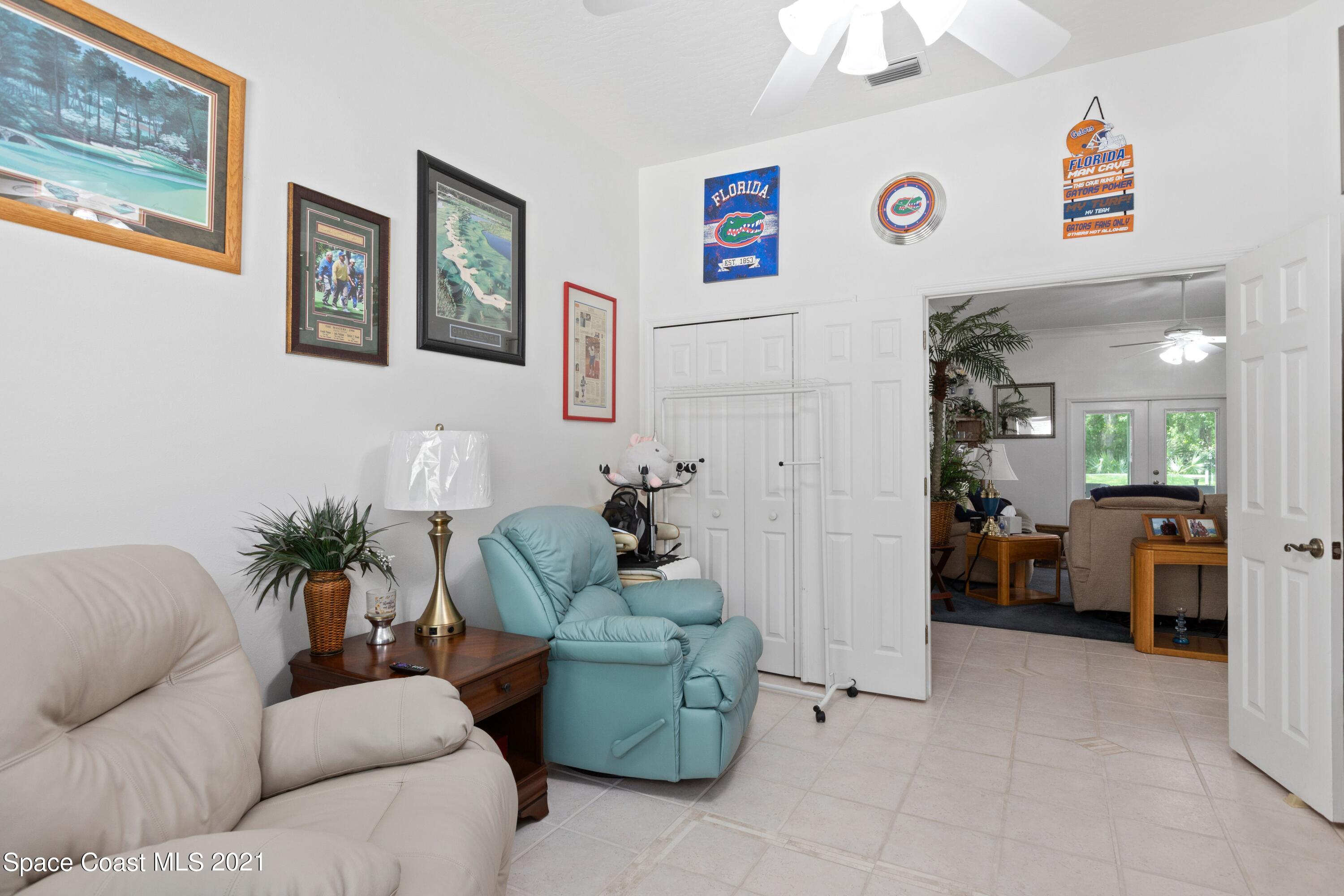 1120 Meadowbrook Road Northeast Palm Bay, FL 32905 - Photo 25 of 33 a living room with furniture and a couch