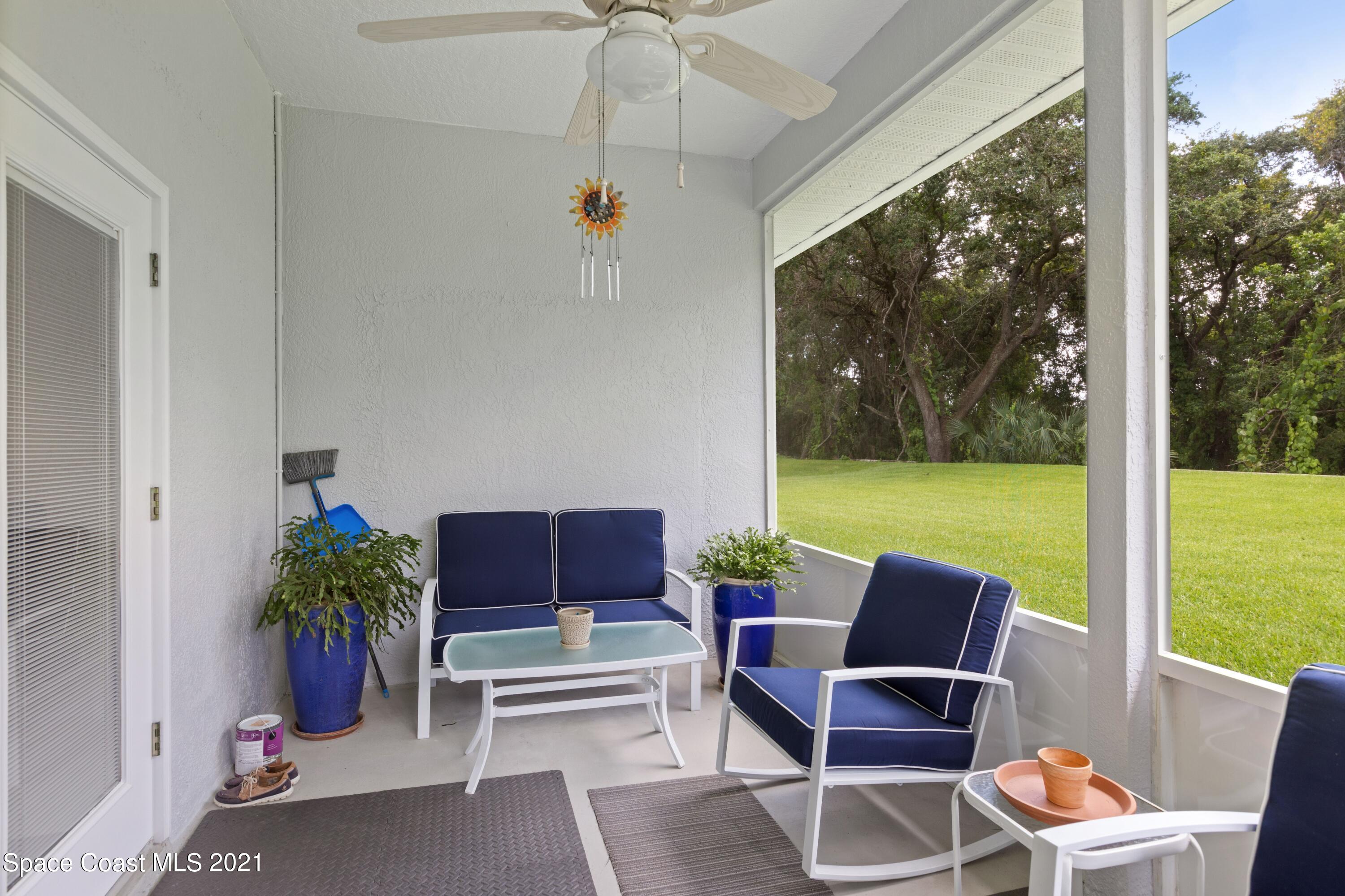 1120 Meadowbrook Road Northeast Palm Bay, FL 32905 - Photo 29 of 33 a building outdoor space with patio furniture and garden