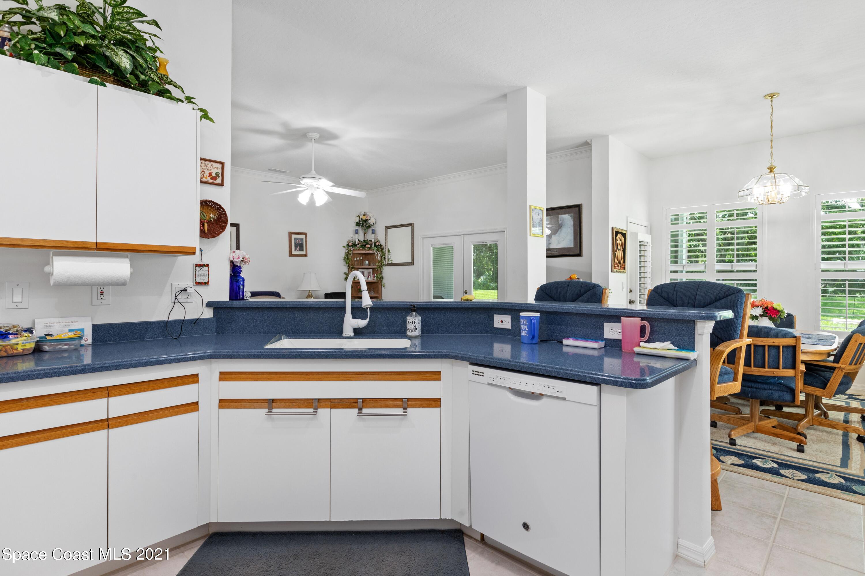 1120 Meadowbrook Road Northeast Palm Bay, FL 32905 - Photo 9 of 33 a view of a kitchen with cabinets