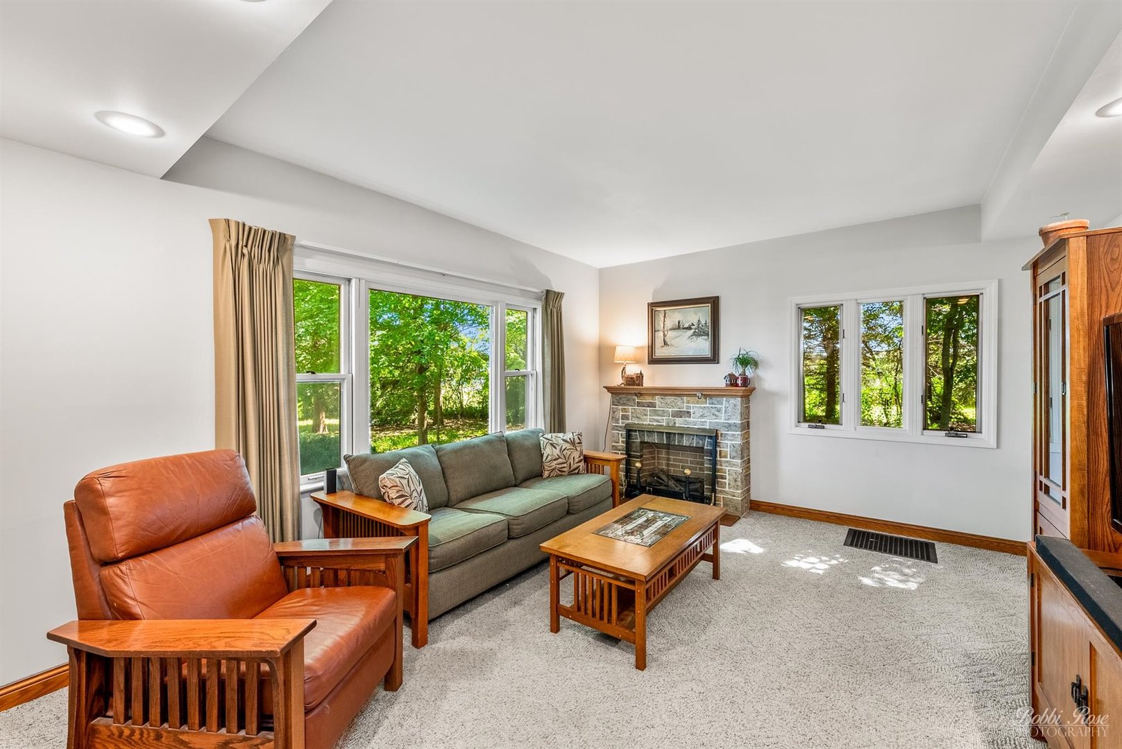 22489 Glidden Road DeKalb, IL 60115 - Photo 14 of 44 a living room with furniture and a floor to ceiling window