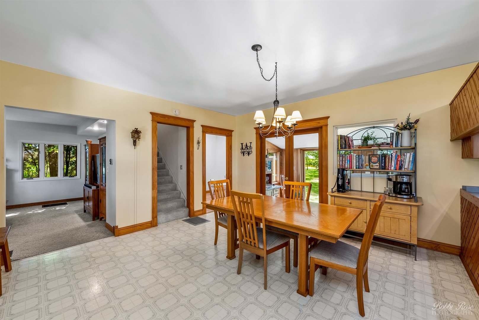 22489 Glidden Road DeKalb, IL 60115 - Photo 8 of 44 a view of a dining room with furniture window and wooden floor