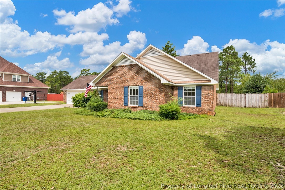 384 East Lake Ridge Road Raeford, NC 28376 - Photo 3 of 36 a view of a house with backyard and garden