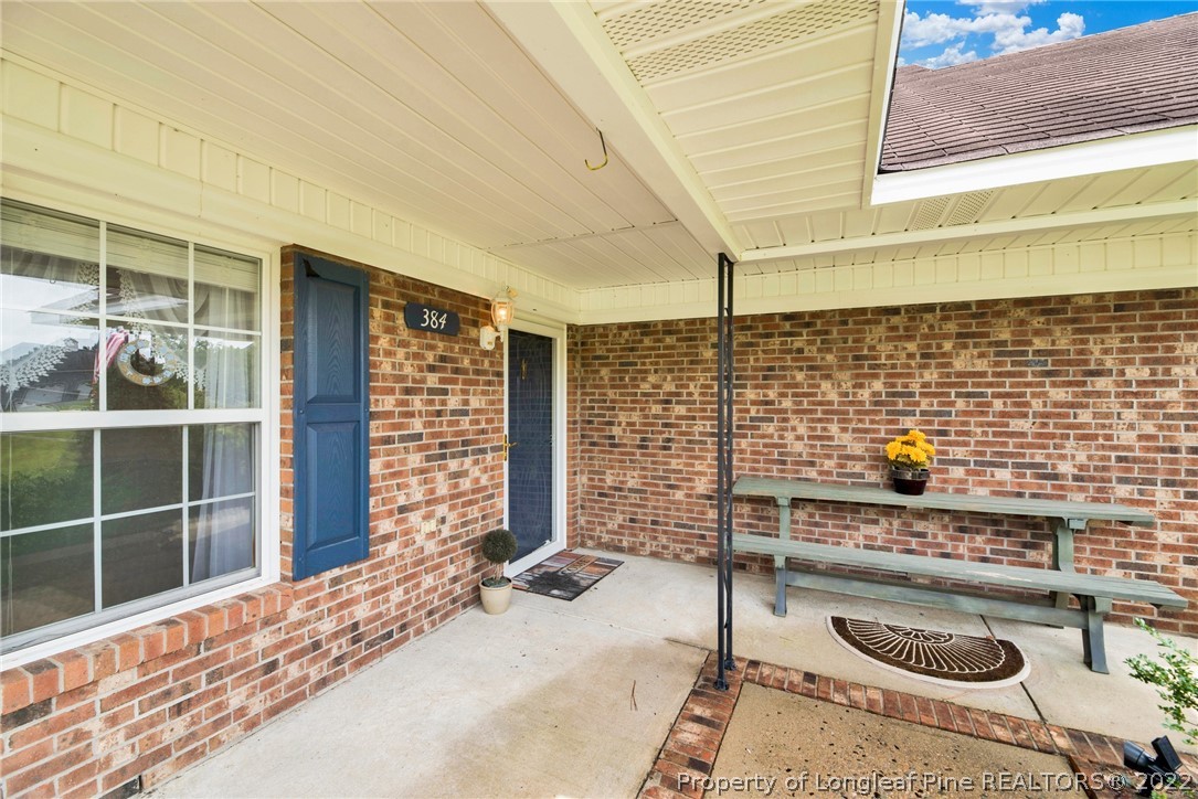 384 East Lake Ridge Road Raeford, NC 28376 - Photo 5 of 36 a backyard of a house with seating space