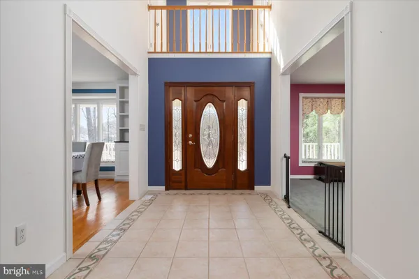 a kitchen with stainless steel appliances granite countertop a stove top oven a sink dishwasher and a fireplace with wooden floor