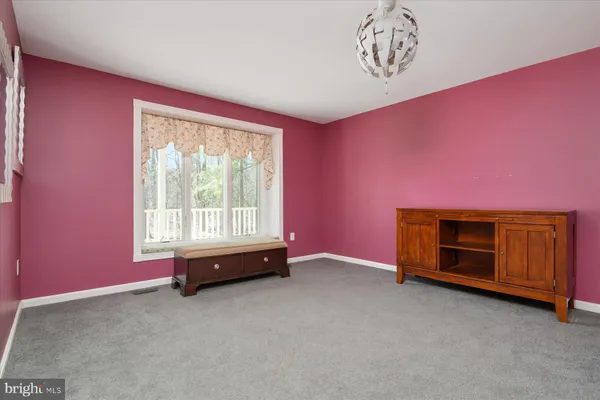 a kitchen with stainless steel appliances granite countertop wooden floors a refrigerator and a stove