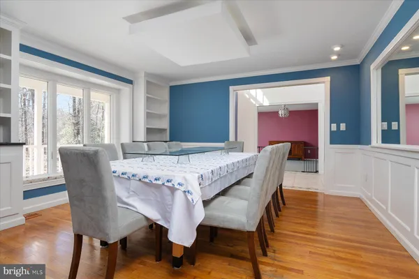 a open kitchen with stainless steel appliances granite countertop a stove a sink a refrigerator and a microwave