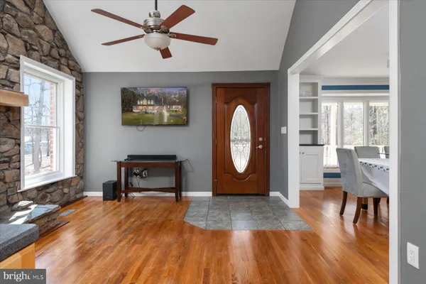a view of kitchen cabinets a sink and a mirror