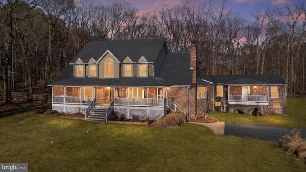 a view of a house with wooden fence