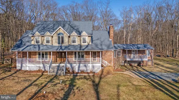 a view of a city with lush green forest