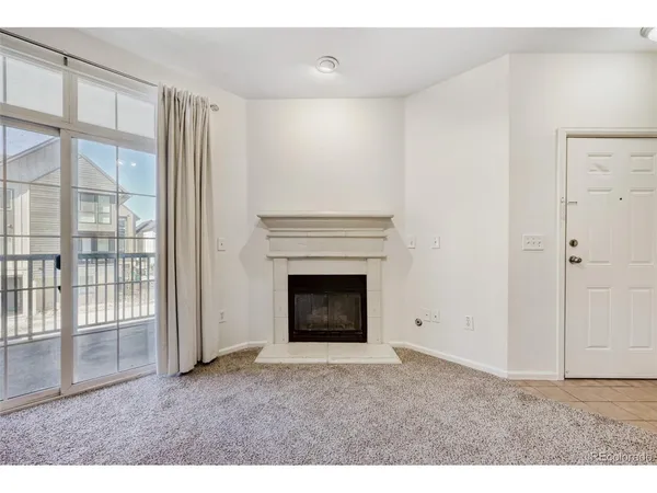 a living room with a fireplace