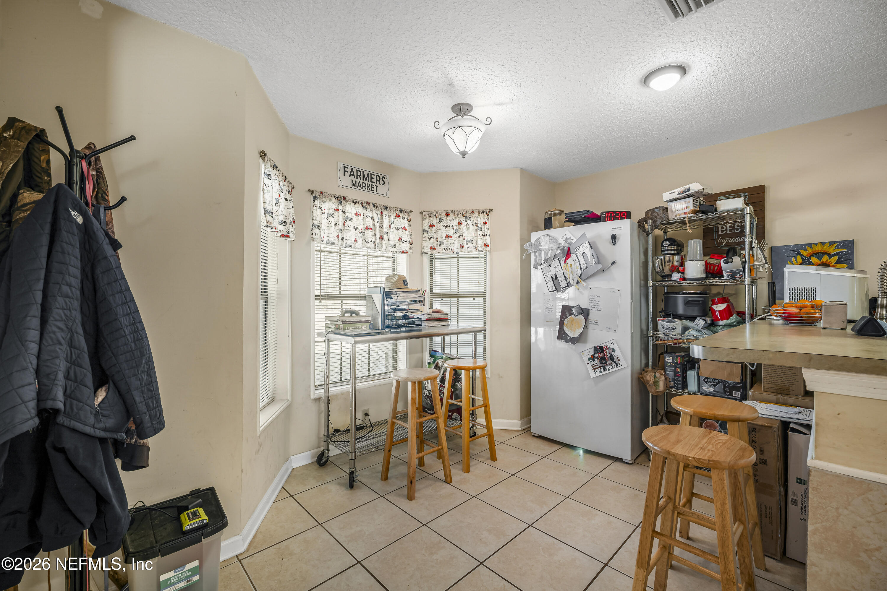 1725 Davidson Farm Road Jacksonville, FL 32218 - Photo 30 of 53 a view of walk in closet with clothes and shoes