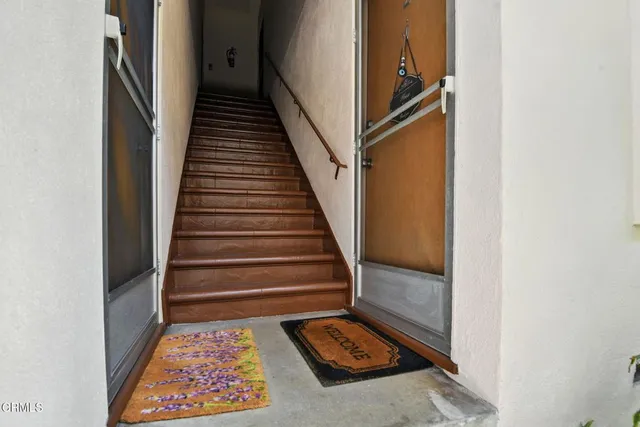 a bedroom with furniture and a wooden floor