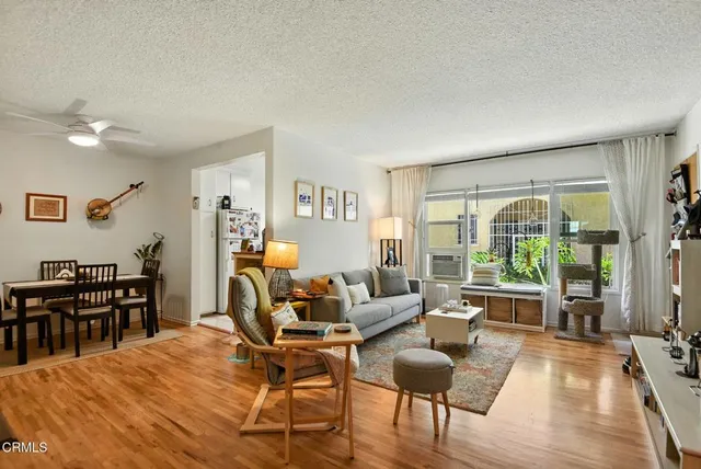 a kitchen with granite countertop white cabinets and sink