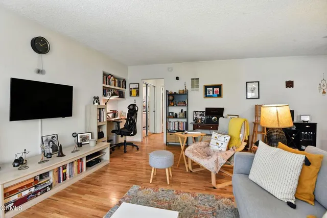 a room with furniture and a flat screen tv