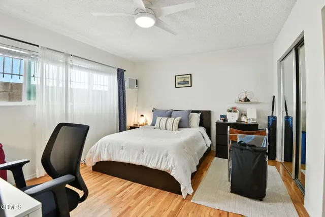 a living room with furniture a couch and a flat screen tv