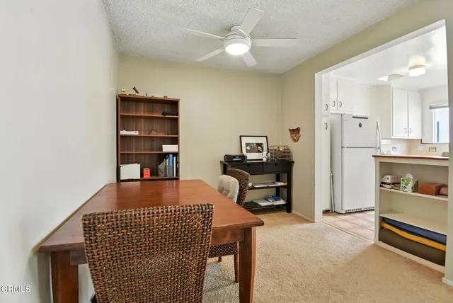 a reading room with furniture a rug and a window