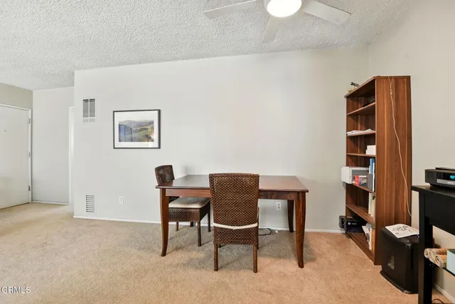 a kitchen with a sink stove top oven and refrigerator