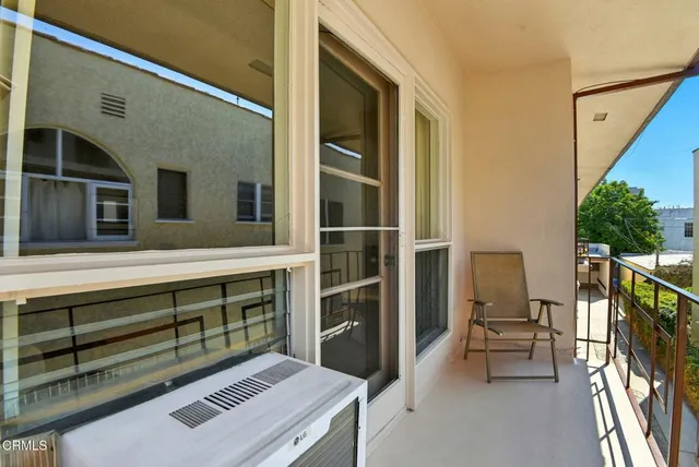 a bedroom with a large bed and a night stand