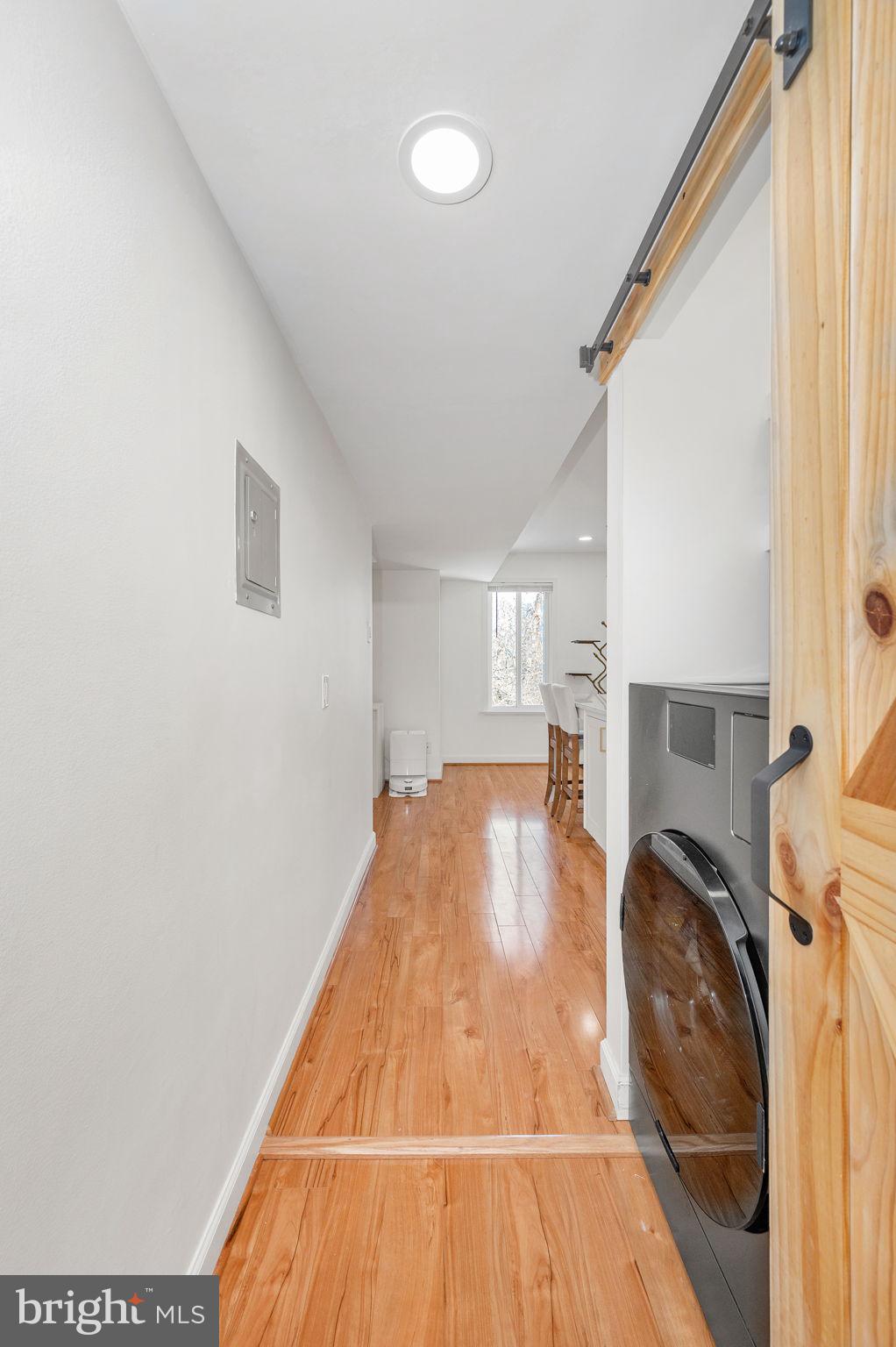 5025 7th Road South, Unit 202 Arlington, VA 22204 - Photo 16 of 39 a view of a livingroom with wooden floor and staircase