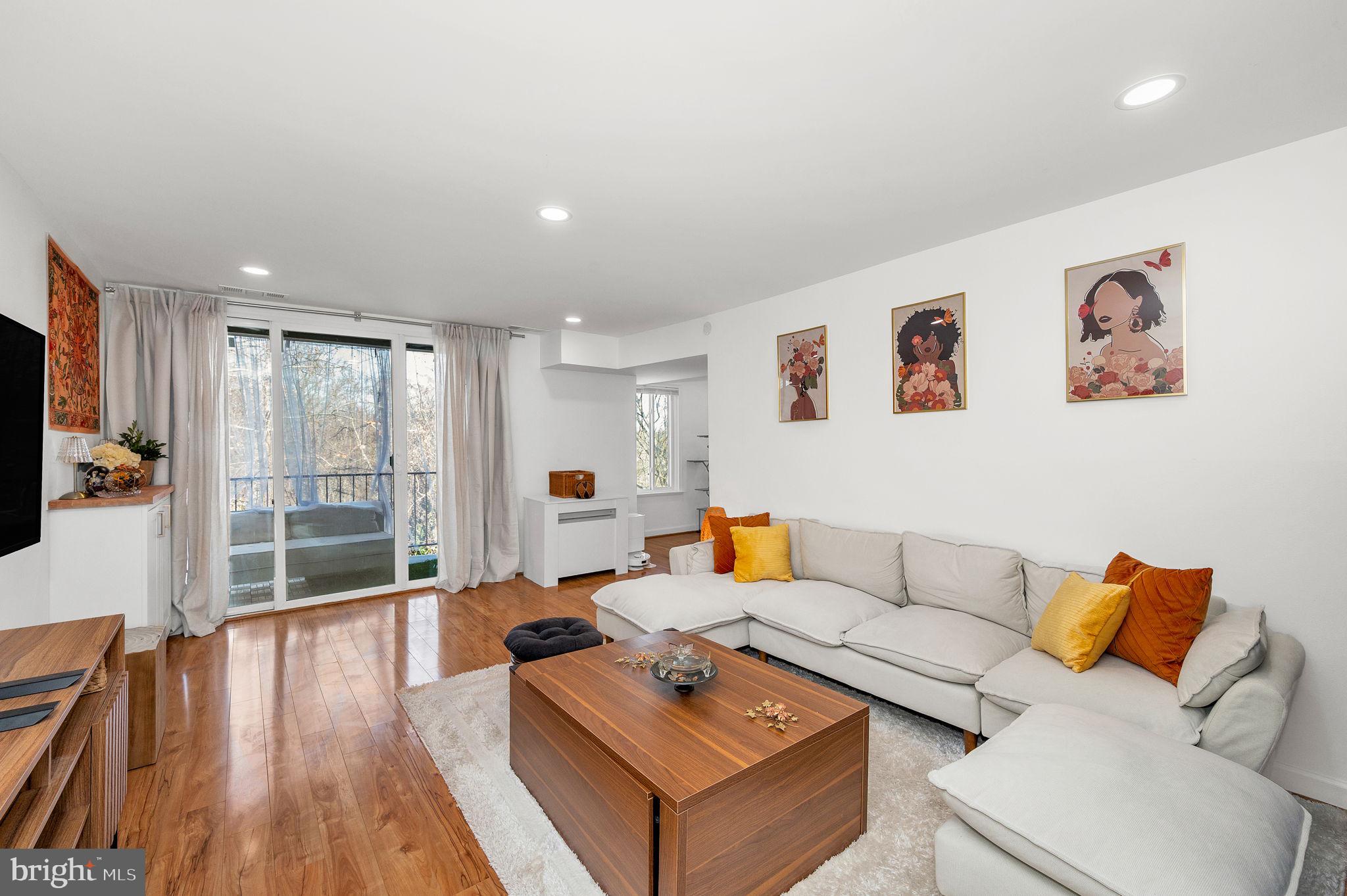 5025 7th Road South, Unit 202 Arlington, VA 22204 - Photo 17 of 39 a living room with furniture and a flat screen tv