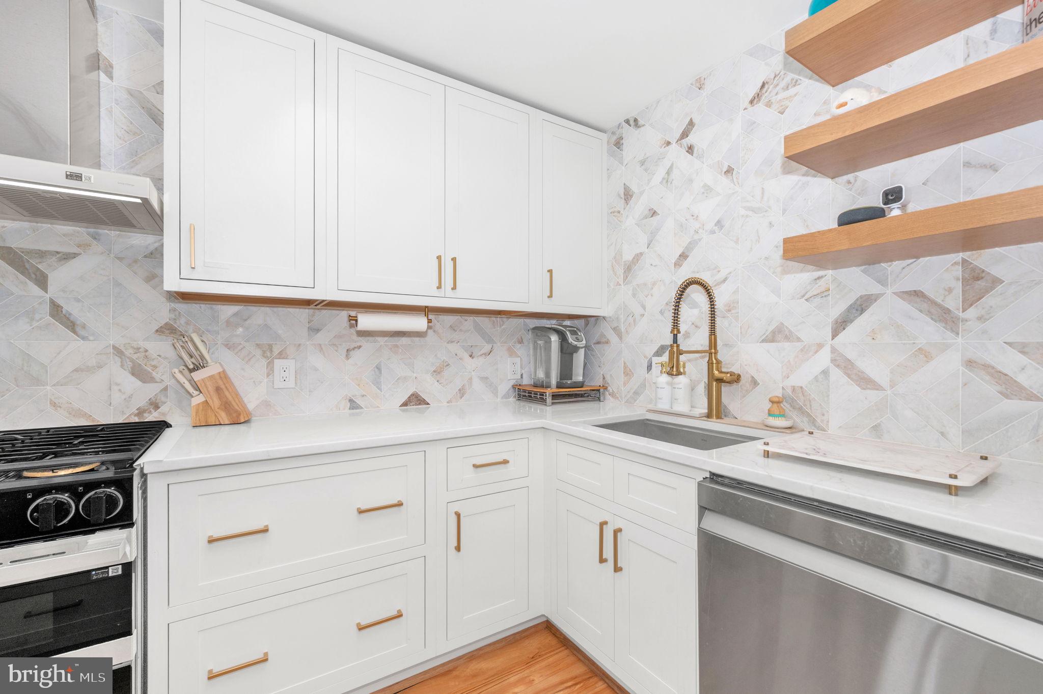 5025 7th Road South, Unit 202 Arlington, VA 22204 - Photo 2 of 39 a kitchen with granite countertop white cabinets and white appliances