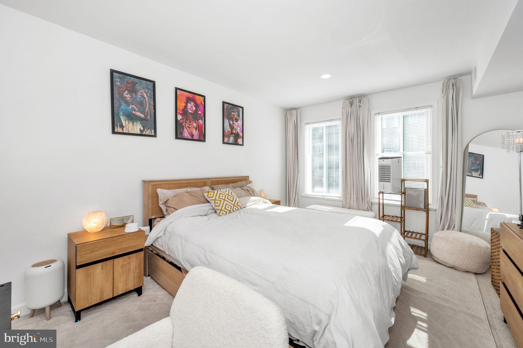 5025 7th Road South, Unit 202 Arlington, VA 22204 - Photo 27 of 39 a bedroom with a bed and wooden floor