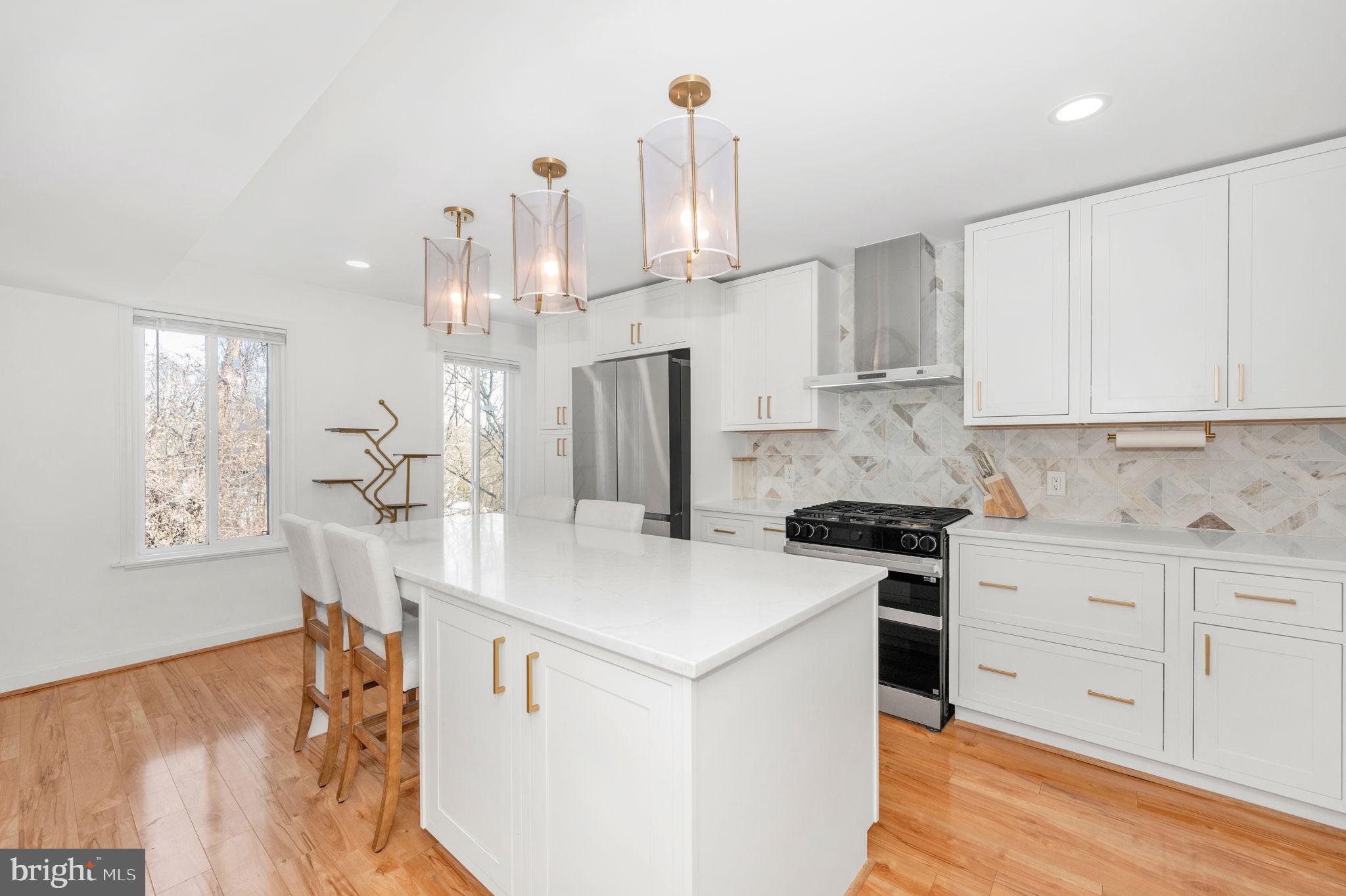 5025 7th Road South, Unit 202 Arlington, VA 22204 - Photo 3 of 39 a kitchen that has a lot of cabinets in it and appliances