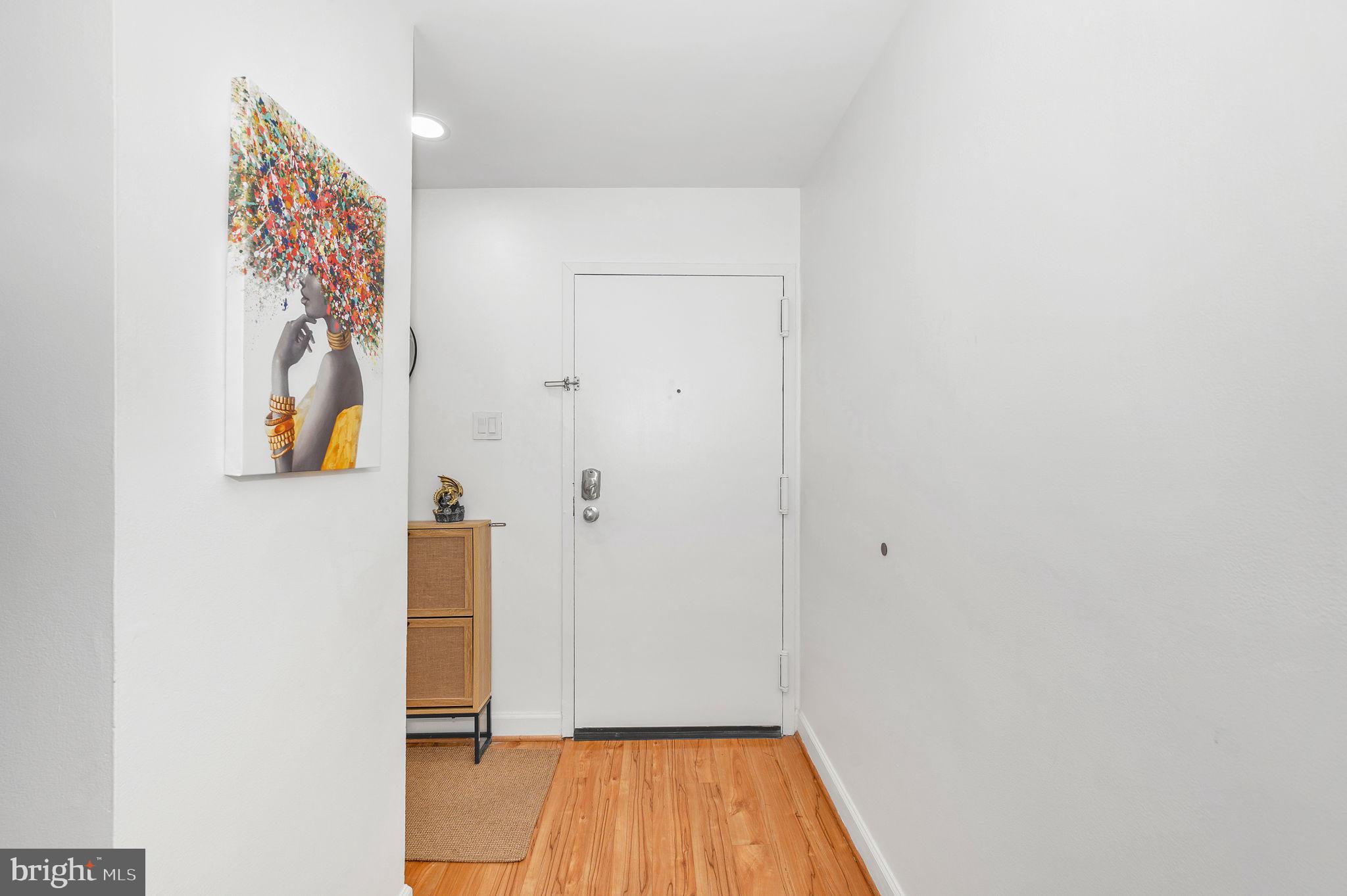 5025 7th Road South, Unit 202 Arlington, VA 22204 - Photo 32 of 39 a view of a hallway with wooden floor