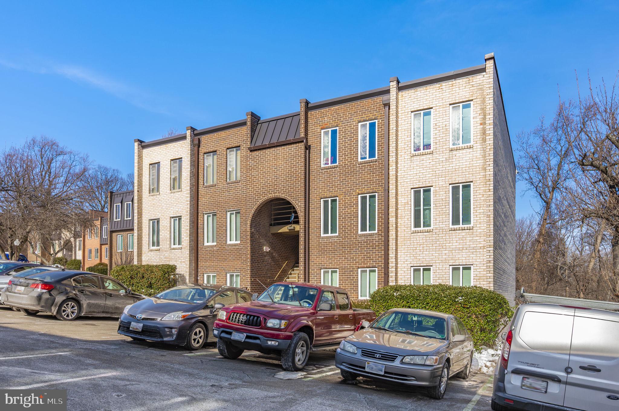 5025 7th Road South, Unit 202 Arlington, VA 22204 - Photo 37 of 39 a car parked in front of a building