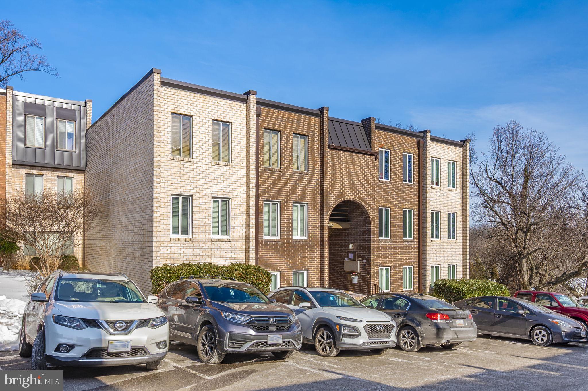 5025 7th Road South, Unit 202 Arlington, VA 22204 - Photo 39 of 39 a couple of cars parked in front of a building