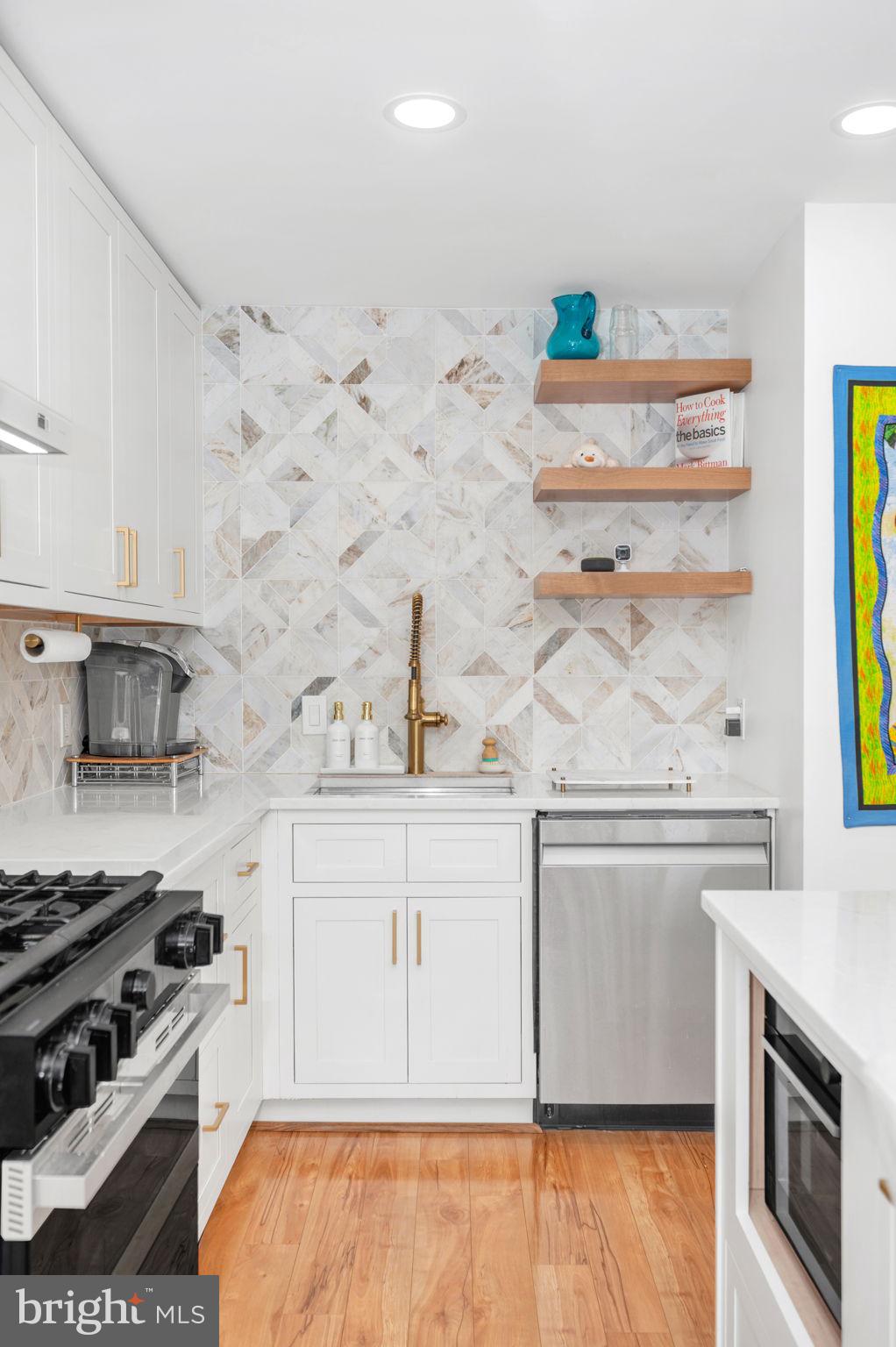 5025 7th Road South, Unit 202 Arlington, VA 22204 - Photo 6 of 39 a kitchen with stainless steel appliances granite countertop a stove and a sink