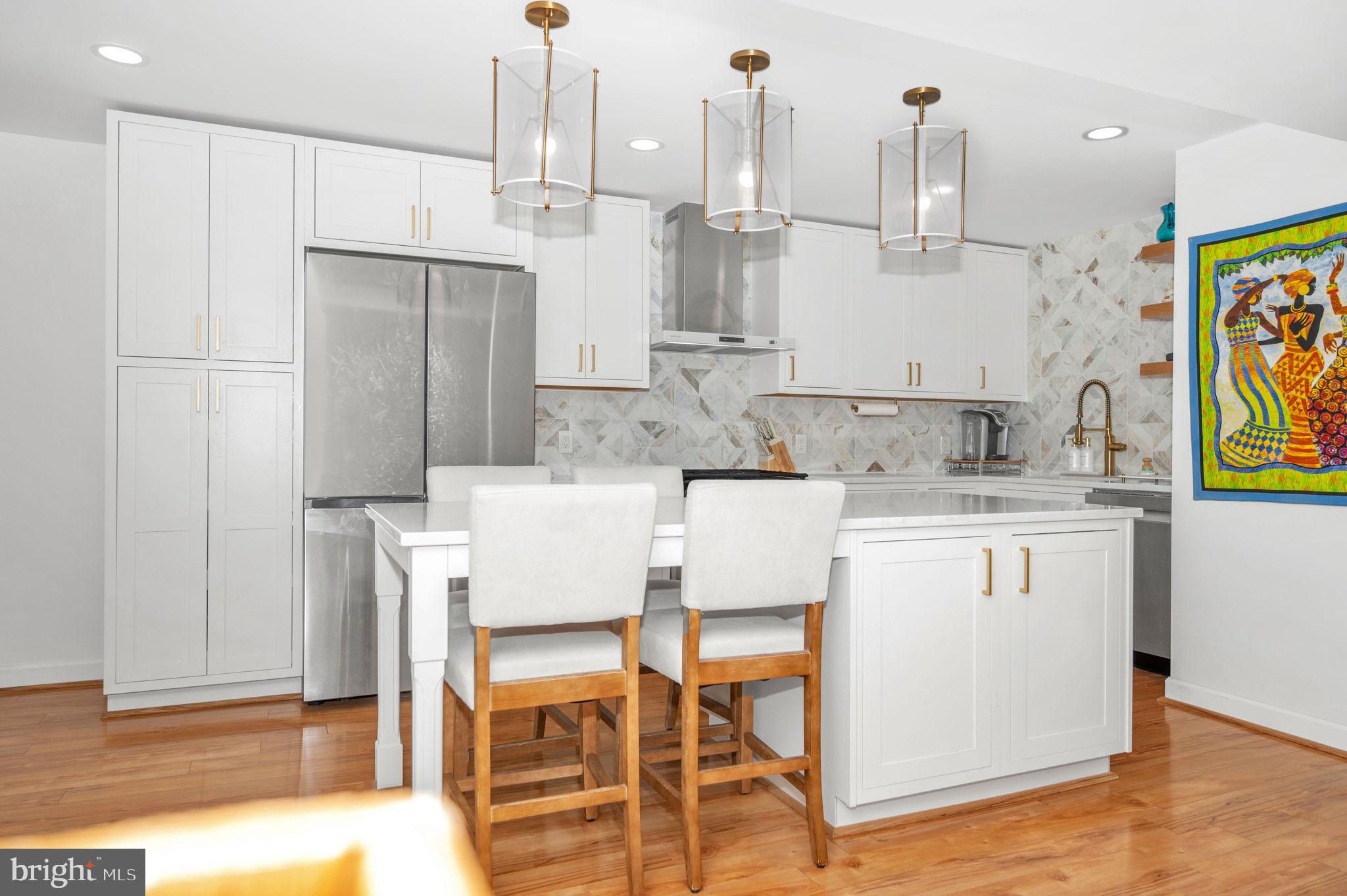 5025 7th Road South, Unit 202 Arlington, VA 22204 - Photo 7 of 39 a view of kitchen with furniture and wooden floor