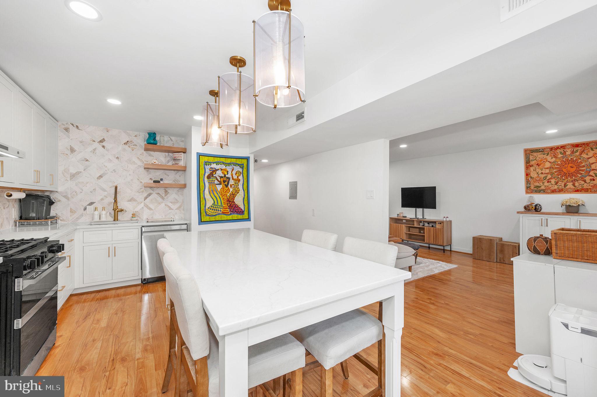 5025 7th Road South, Unit 202 Arlington, VA 22204 - Photo 8 of 39 a large kitchen with a table and chairs in it