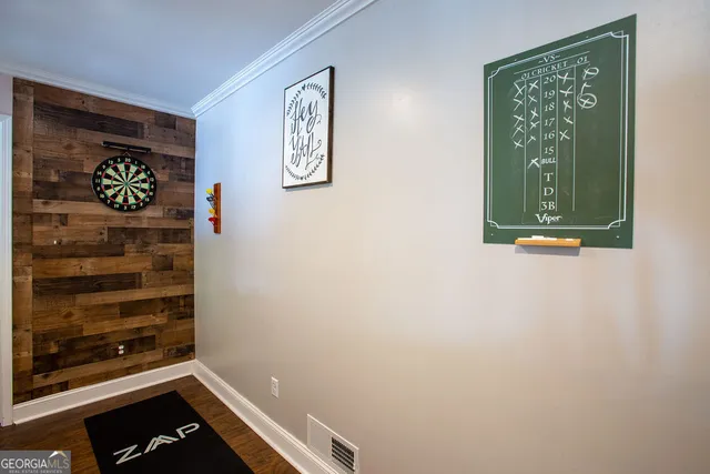 a view of a hallway with paintings on the wall