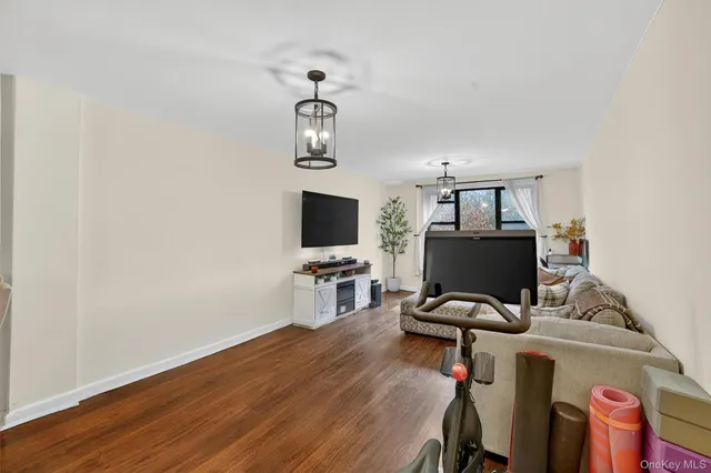 a view of a workspace with furniture and a flat screen tv
