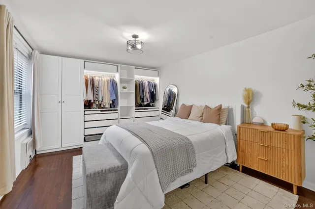 a bedroom with bed and window