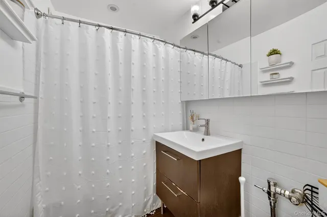 a bathroom with a sink and mirror