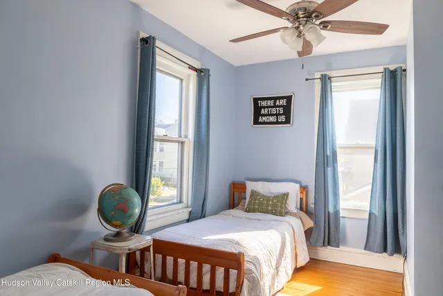 a bedroom with a bed and window