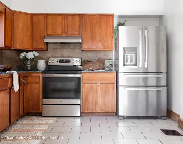 a kitchen with cabinets and steel stainless steel appliances
