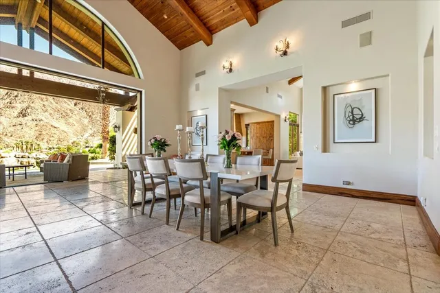 a view of a dining room with furniture window and outside view