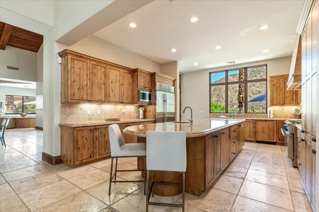 a bedroom with a large bed and a large window
